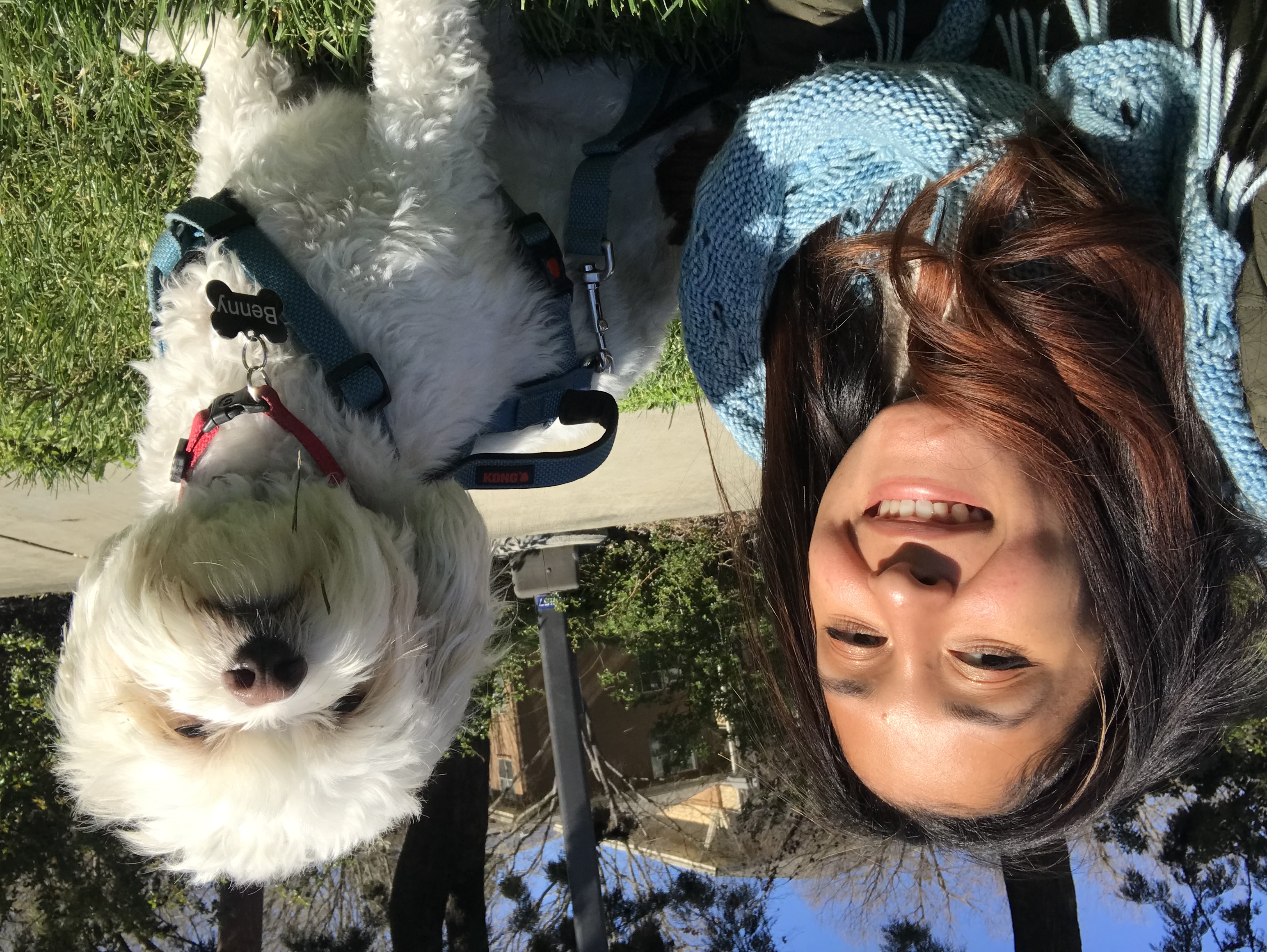 Jillian Padilla posing with her dog in the grass