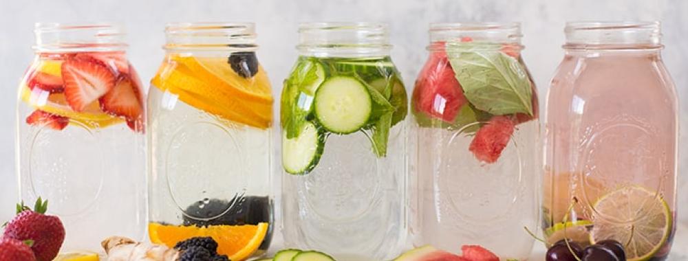 Mason jars filled with fruit infused water