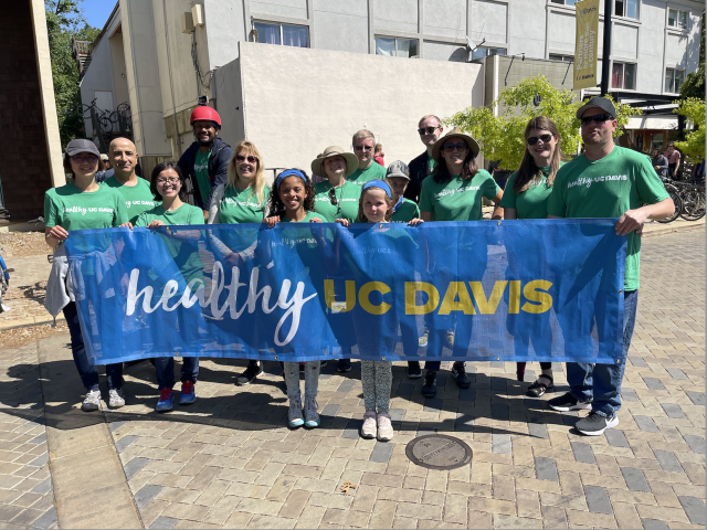 Healthy uc davis marching with banner on picnic day