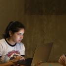 Danielle Facho, an aerospace engineering major, is bathed in the light of her laptop computer