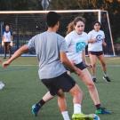 Students playing soccer on an intramural field at UC Davis